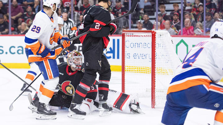 Oct 18, 2025; Ottawa, Ontario, CAN; New York Islanders center Bo Horvat (14) scores against Ottawa Senators goalie Linus Ullmark (35) in the second period at the Canadian Tire Centre. Mandatory Credit: Marc DesRosiers-IMAGN Images