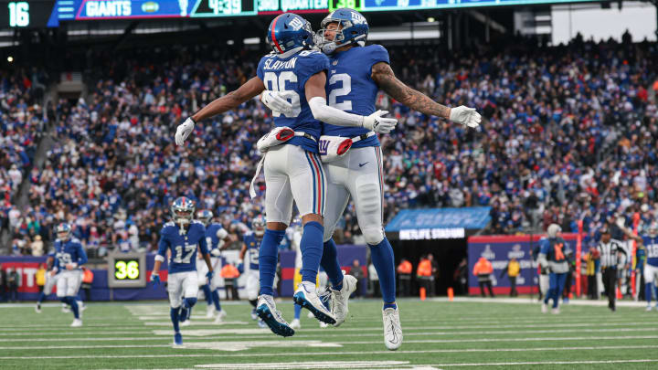 Dec 31, 2023; East Rutherford, New Jersey, USA; New York Giants wide receiver Darius Slayton (86) celebrates with tight end Darren Waller (12) after his touchdown reception during the second half against the Los Angeles Rams at MetLife Stadium.  