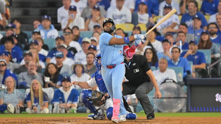 Oct 28, 2025; Los Angeles, California, USA; Toronto Blue Jays first baseman Vladimir Guerrero Jr. (27) hits a two run home run during the third inning against the Los Angeles Dodgers during game four of the 2025 MLB World Series at Dodger Stadium. Mandatory Credit: Jayne Kamin-Oncea-Imagn Images Oct 28, 2025; Los Angeles, California, USA; Toronto Blue Jays first baseman Vladimir Guerrero Jr. (27) hits a two run home run during the third inning against the Los Angeles Dodgers during game four of the 2025 MLB World Series at Dodger Stadium. Mandatory Credit: Jayne Kamin-Oncea-Imagn Images