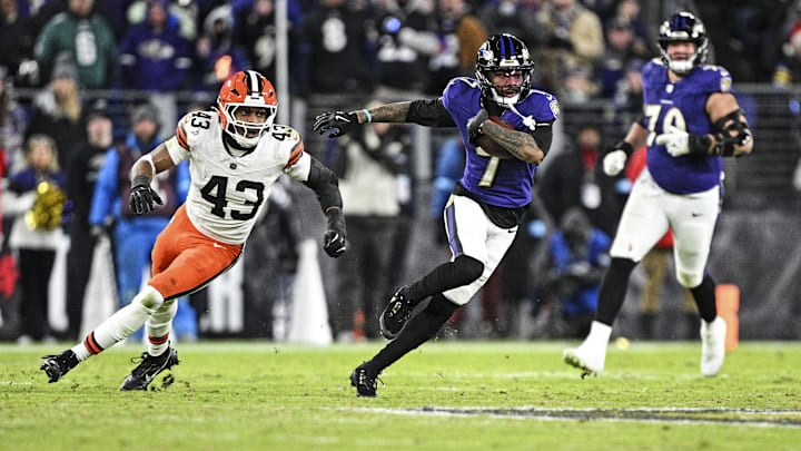 Jan 4, 2025; Baltimore, Maryland, USA; Baltimore Ravens wide receiver Rashod Bateman (7) runs the ball as Cleveland Browns linebacker Mohamoud Diabate (43) defends during the fourth quarter at M&T Bank Stadium. Mandatory Credit: Tommy Gilligan-Imagn Images