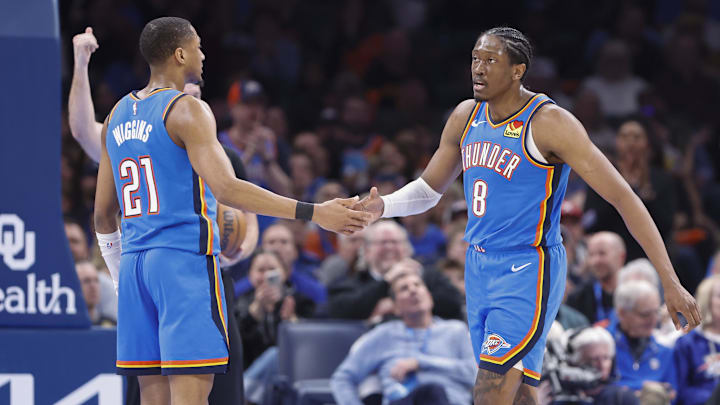 Feb 7, 2025; Oklahoma City, Oklahoma, USA; Oklahoma City Thunder guard Aaron Wiggins (21) and forward Jalen Williams (8) high five after a play against the Toronto Raptors during the second half at Paycom Center.