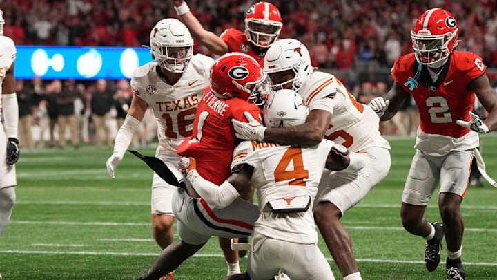 Dec 7, 2024; Atlanta, GA, USA; Georgia Bulldogs running back Trevor Etienne (1) rushes for a touchdown against the Texas Longhorns during the second half in the 2024 SEC Championship game at Mercedes-Benz Stadium. Mandatory Credit: Dale Zanine-Imagn Images