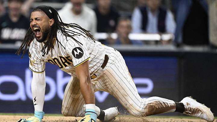 Sep 29, 2026; San Diego, California, USA;  San Diego Padres outfielder Fernando Tatis Jr. (23) celebrates after scoring against the Chicago Cubs during the seventh inning during game one of the Wildcard round for the 2026 MLB Playoffs at Petco Park.  Mandatory Credit: Denis Poroy-Imagn Images