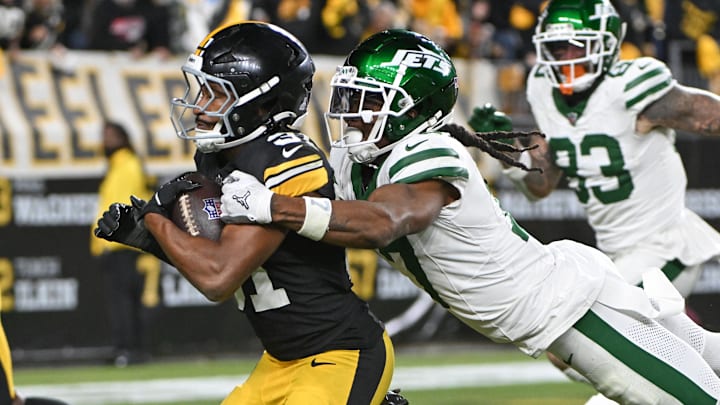 Oct 20, 2024; Pittsburgh, Pennsylvania, USA; Pittsburgh Steelers cornerback Beanie Bishop Jr. (31) returns an interception while being pursued by New York Jets wide receiver Davante Adams (17) during the third quarter at Acrisure Stadium. 