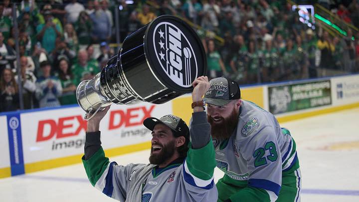 Florida Everblades forward Cam Darcy, who was injured in Game 1 of the Eastern Conference Finals, is pushed around Hertz Arena by Todd Skirving after the Blades won 4-3 in overtime to win Game 5 of the ECHL Kelly Cup Finals against the Kansas City Mavericks on June 8, 2024. The Everblades won for the third time in a row.