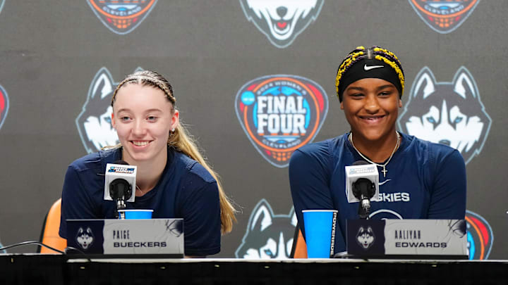 Apr 4, 2024; Cleveland, OH, USA; UConn Huskies coach Geno Auriemma (left), guard Paige Bueckers (center) and forward Aaliyah Edwards during press conference at Rocket Mortgage FieldHouse. Mandatory Credit: Kirby Lee-Imagn Images Apr 4, 2024; Cleveland, OH, USA; UConn Huskies coach Geno Auriemma (left), guard Paige Bueckers (center) and forward Aaliyah Edwards during press conference at Rocket Mortgage FieldHouse. Mandatory Credit: Kirby Lee-Imagn Images