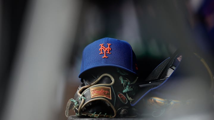 Aug 8, 2024; Denver, Colorado, USA; A New York Mets hat and glove in the dugout in the second inning against the Colorado Rockies at Coors Field. Mandatory Credit: Isaiah J. Downing-Imagn Images