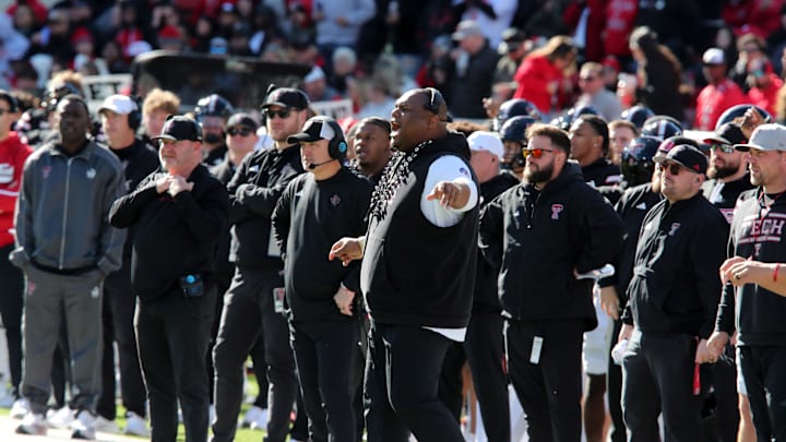 Nov 30, 2024; Lubbock, Texas, USA;  Texas Tech Red Raiders associate head coach Kenny Perry, head coach Joey McGuire and defensive line coach Zarnell Fitch on the sidelines in the first half during the game against the West Virginia Mountaineers at Jones AT&T Stadium and Cody Campbell Field. Mandatory Credit: Michael C. Johnson-Imagn Images