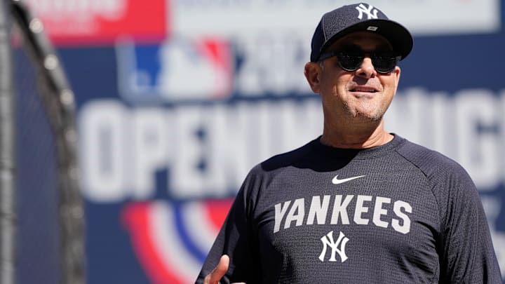 New York Yankees manager Aaron Boone (17) stands on the field before the start of the game against the San Francisco Giants at Oracle Park.