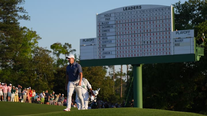 Rory McIlroy walks up the 18th fairway at Augusta National.