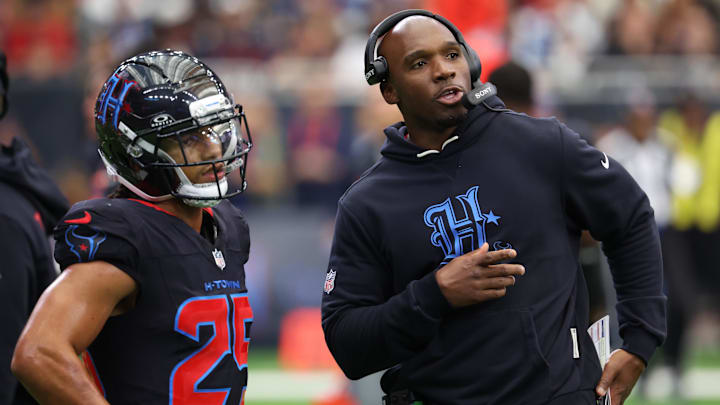 Jan 4, 2026; Houston, Texas, USA;  Houston Texans head coach Demeco Ryans with cornerback Myles Bryant (25) on the sidelines during the second half against the Indianapolis Colts at NRG Stadium. Mandatory Credit: Thomas Shea-Imagn Images