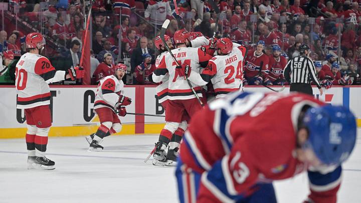 May 25, 2026; Montreal, Quebec, CAN; Carolina Hurricanes players celebrate after winning game three of the Eastern Conference Final against the Montreal Canadiens of the 2026 Stanley Cup Playoffs at Bell Centre. Mandatory Credit: Eric Bolte-Imagn Images