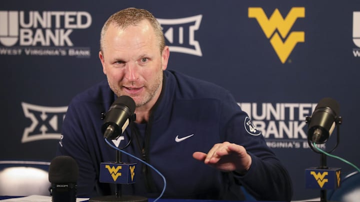 Mar 8, 2025; Morgantown, West Virginia, USA; West Virginia Mountaineers head coach Darian DeVries answers questions from the media after defeating the UCF Knights at WVU Coliseum. Mandatory Credit: Ben Queen-Imagn Images