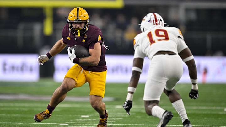 Dec 7, 2024; Arlington, TX, USA; Arizona State Sun Devils running back Cam Skattebo (4) and Iowa State Cyclones defensive back Ta'Shawn James (19) in action during the game between the Iowa State Cyclones and the Arizona State Sun Devils at AT&T Stadium. Mandatory Credit: Jerome Miron-Imagn Images