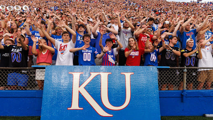 Aug 29, 2025; Lawrence, Kansas, USA; Kansas Jayhawks student fans celebrate a touch down during the first half against the Wagner Seahawks  at David Booth Kansas Memorial Stadium. Mandatory Credit: William Purnell-Imagn Images