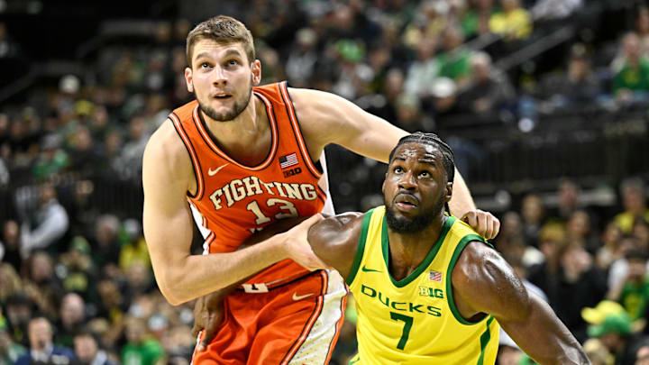 Illinois center Tomislav Ivisic (13) battles for rebound position with Oregon forward Supreme Cook on Jan 2, 2025.
