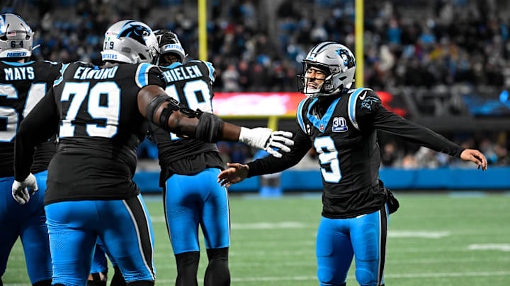 Dec 1, 2024; Charlotte, North Carolina, USA; Carolina Panthers quarterback Bryce Young (9) celebrates with offensive tackle Ikem Ekwonu (79) after the panthers score with 30 seconds left to take the lead in the fourth quarter at Bank of America Stadium. Mandatory Credit: Bob Donnan-Imagn Images