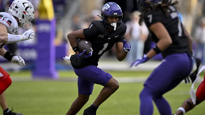 Nov 29, 2025; Fort Worth, Texas, USA; TCU Horned Frogs wide receiver Eric McAlister (1) runs with the ball during the game between the Horned Frogs and the Bearcats at Amon G. Carter Stadium. Mandatory Credit: Jerome Miron-Imagn Images