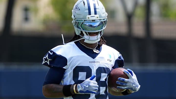 Dallas Cowboys receiver CeeDee Lamb carries the ball during training camp at the River Ridge Fields. Dallas Cowboys receiver CeeDee Lamb carries the ball during training camp at the River Ridge Fields.