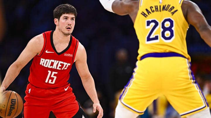Apr 11, 2025; Los Angeles, California, USA; Houston Rockets guard Reed Sheppard (15) looks to shoot against Los Angeles Lakers forward Rui Hachimura (28) during the second half at Crypto.com Arena. Mandatory Credit: Jonathan Hui-Imagn Images