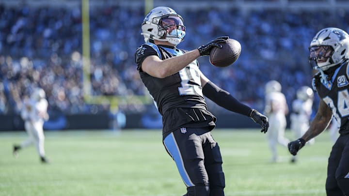 Dec 22, 2024; Charlotte, North Carolina, USA;  Carolina Panthers wide receiver Adam Thielen (19) reacts to his touchdown catch against the Arizona Cardinals during the second quarter at Bank of America Stadium. Mandatory Credit: Jim Dedmon-Imagn Images