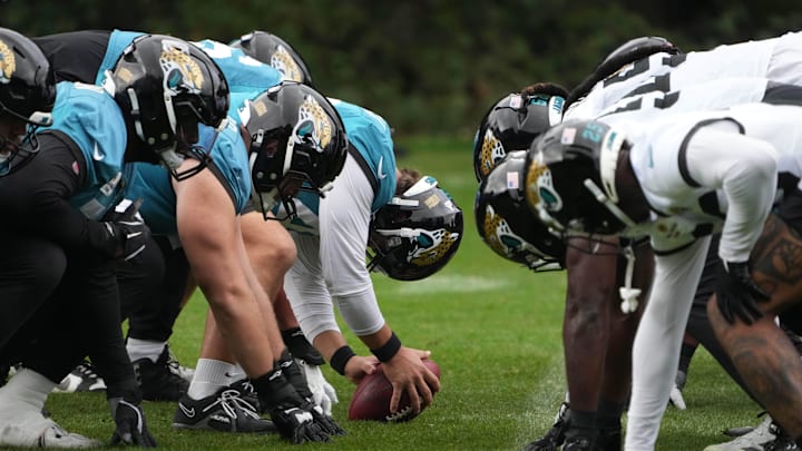 Oct 16, 2024; Watford, United Kingdom; A general overall view of helmets at the line of scrimmage as Jacksonville Jaguars long snapper Ross Matiscik (46) snaps the ball during practice at The Grove. Mandatory Credit: Kirby Lee-Imagn Images Oct 16, 2024; Watford, United Kingdom; A general overall view of helmets at the line of scrimmage as Jacksonville Jaguars long snapper Ross Matiscik (46) snaps the ball during practice at The Grove. Mandatory Credit: Kirby Lee-Imagn Images