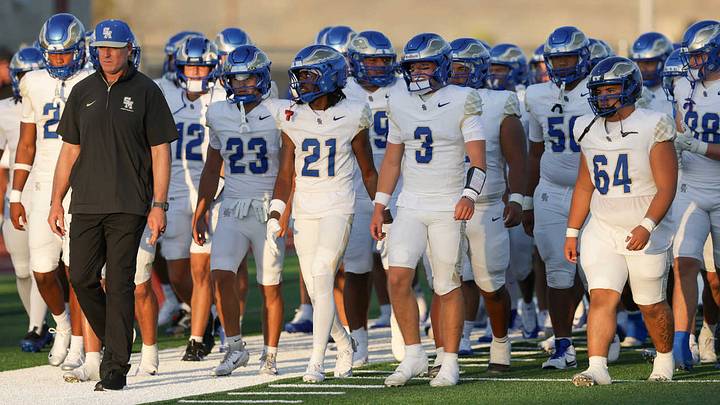 Santa Margarita walks out onto the field led by head coach Carson Palmer before taking on Corona Centennial.