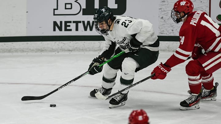 MSU's Shane Vansaghi moves the puck against Wisconsin, Thursday, Jan. 2, 2024, at Munn Ice Arena. MSU won 4-3.