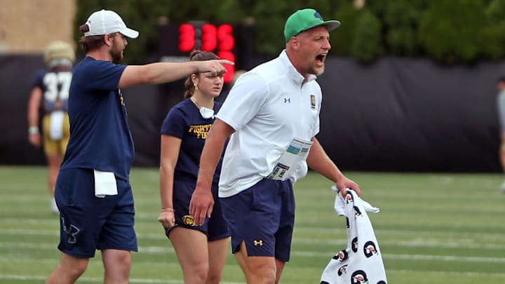 Notre Dame linebackers coach Max Bullough screams in a drill during a practice Friday, August 2, 2024, at the Irish Athletics Center in South Bend. Notre Dame linebackers coach Max Bullough screams in a drill during a practice Friday, August 2, 2024, at the Irish Athletics Center in South Bend.