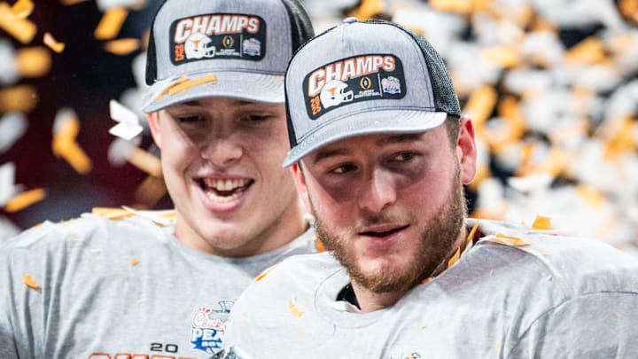 Texas Longhorns quarterback Quinn Ewers (3) poses with the the trophy as the Texas Longhorns celebrate their 39-31 double overtime win over the Arizona State Sun Devils in the Peach Bowl College Football Playoff quarterfinal at Mercedes-Benz Stadium in Atlanta, Georgia, Jan. 1, 2025.