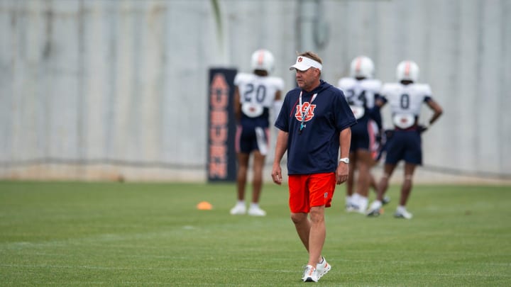 Auburn Tigers head coach Hugh Freeze walks the field during practice at Woltosz Football Performance