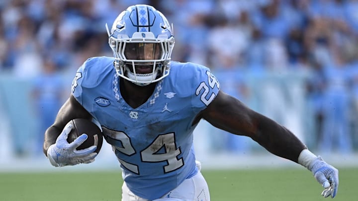 Sep 16, 2023; Chapel Hill, North Carolina, USA; DUPLICATE***North Carolina Tar Heels running back British Brooks (24)***North Carolina Tar Heels linebacker Malaki Hamrick (24) with the ball as Minnesota Golden Gophers linebacker Maverick Baranowski (6) defends in the fourth quarter at Kenan Memorial Stadium. Mandatory Credit: Bob Donnan-USA TODAY Sports