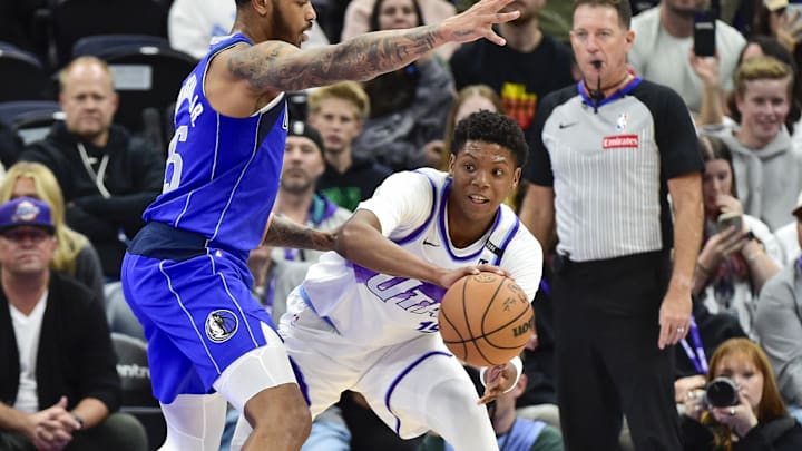 Oct 13, 2025; Salt Lake City, Utah, USA; Utah Jazz forward Ace Bailey (19) makes a pass around Dallas Mavericks forward P.J. Washington (25) during the second quarter at Delta Center. Mandatory Credit: Peter Creveling-Imagn Images