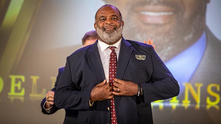 Odell Haggins puts on his Hall Of Fame jacket as he is inducted into the Hall of Fame during the 2022 Polk County All Sports Awards at the RP Funding Center in Lakeland  Fl. Tuesday June 14,  2022.  ERNST PETERS/ THE LEDGER

061422 Ep Sports 2 News