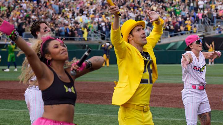 Jesse Cole, center left, and the Oregon Duck dance in matching yellow suits as the Savannah Bananas visit Autzen Stadium in Eugene, Oregon on June 27, 2026. Jesse Cole, center left, and the Oregon Duck dance in matching yellow suits as the Savannah Bananas visit Autzen Stadium in Eugene, Oregon on June 27, 2026.