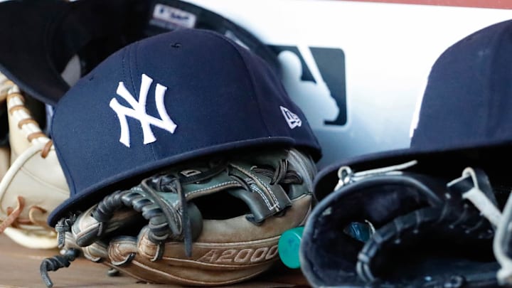 Jun 18, 2018; Washington, DC, USA; New York Yankees players caps and gloves rest in the dugout against the Washington Nationals at Nationals Park. Mandatory Credit: Geoff Burke-Imagn Images