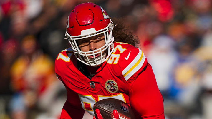 Dec 14, 2025; Kansas City, Missouri, USA; Kansas City Chiefs defensive end Ashton Gillotte (97) returns an interception against the Los Angeles Chargers during the second quarter at GEHA Field at Arrowhead Stadium. Mandatory Credit: Jay Biggerstaff-Imagn Images