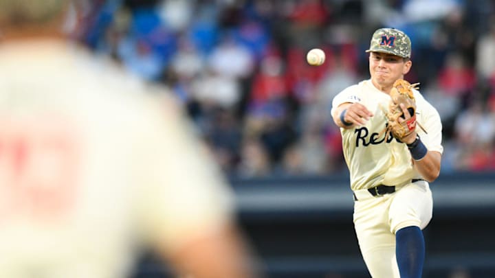 Ole Miss infielder Luke Hill (7) fields, steps on second for an out, and throws to first for a double play in the 2nd inning at Swayze Field in Oxford, Miss., on Friday, Apr. 12, 2024.