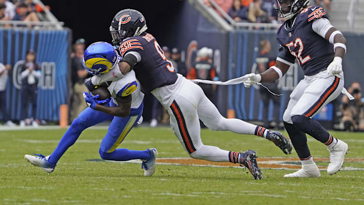 Sep 29, 2024; Chicago, Illinois, USA; Chicago Bears defensive end Darrell Taylor (52) and safety Jaquan Brisker (9)  tackle  Los Angeles Rams running back Kyren Williams (23) during the second half at Soldier Field. Mandatory Credit: David Banks-Imagn Images