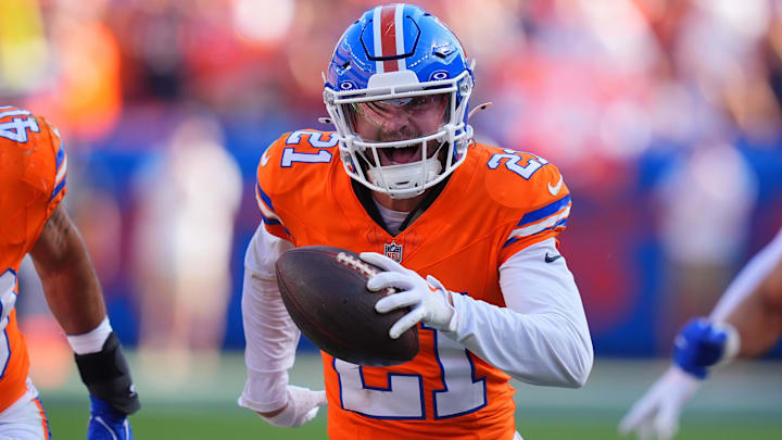Oct 6, 2024; Denver, Colorado, USA; Denver Broncos cornerback Riley Moss (21) celebrates his interception in the second half against the Las Vegas Raiders at Empower Field at Mile High. Oct 6, 2024; Denver, Colorado, USA; Denver Broncos cornerback Riley Moss (21) celebrates his interception in the second half against the Las Vegas Raiders at Empower Field at Mile High.