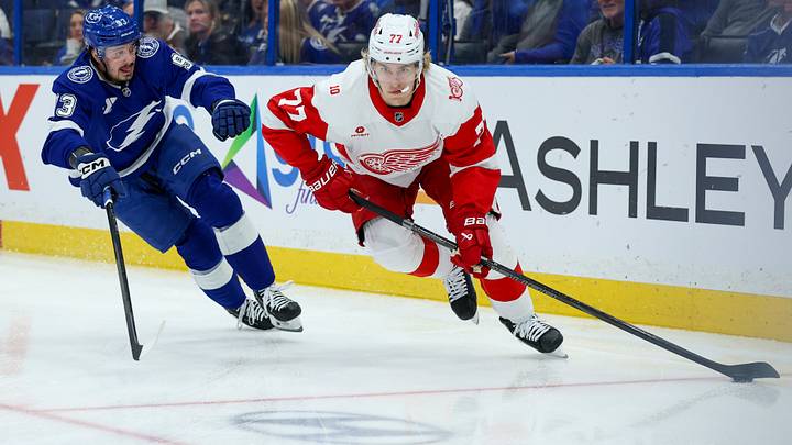Apr 13, 2026; Tampa, Florida, USA; Detroit Red Wings defenseman Simon Edvinsson (77) controls the puck against the Tampa Bay Lightning in the first period at Benchmark International Arena. Mandatory Credit: Nathan Ray Seebeck-Imagn Images