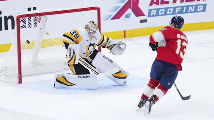 Jan 3, 2025; Sunrise, Florida, USA; Florida Panthers center Sam Reinhart (13) scores against Pittsburgh Penguins goaltender Tristan Jarry (35) during a shootout at Amerant Bank Arena. Mandatory Credit: Rich Storry-Imagn Images