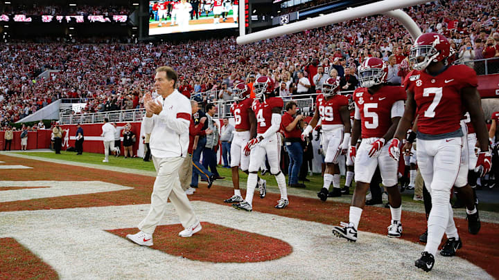 Coach Nick Saban leads the Crimson Tide onto the field before Alabama's homecoming game against Arkansas in Bryant-Denny Stadium Saturday, Oct. 26, 2019.