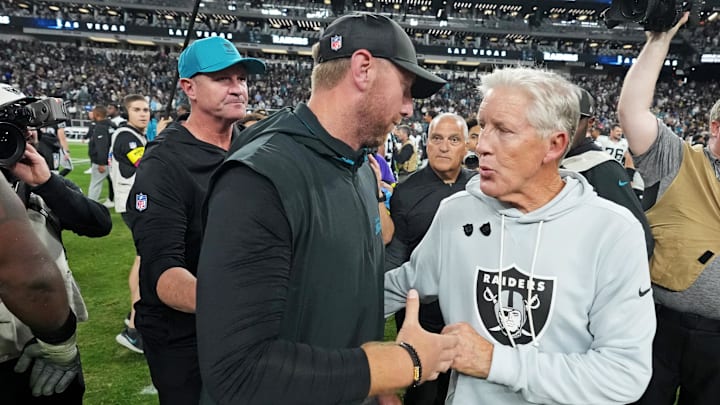 Nov 2, 2025; Paradise, Nevada, USA; The Jacksonville Jaguars head coach Liam Coen and the Las Vegas Raiders head coach Pete Carroll meet after the win against the Las Vegas Raiders at Allegiant Stadium. Mandatory Credit: Kirby Lee-Imagn Images