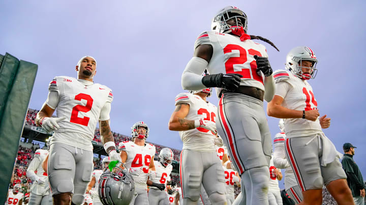 Sep 28, 2024; East Lansing, Michigan, USA; Ohio State Buckeyes cornerback Calvin Simpson-Hunt (22) runs on the field before the game against the Michigan State Spartans at Spartan Stadium on Saturday.