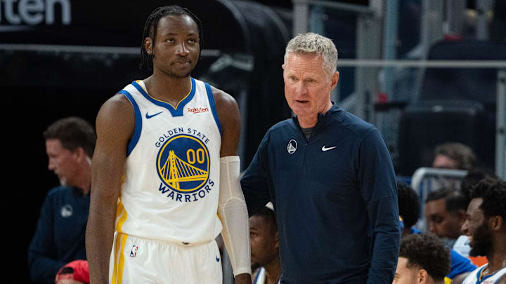 October 20, 2023; San Francisco, California, USA; Golden State Warriors head coach Steve Kerr (right) talks to forward Jonathan Kuminga (00) during the third quarter against the San Antonio Spurs at Chase Center. Mandatory Credit: Kyle Terada-Imagn Images