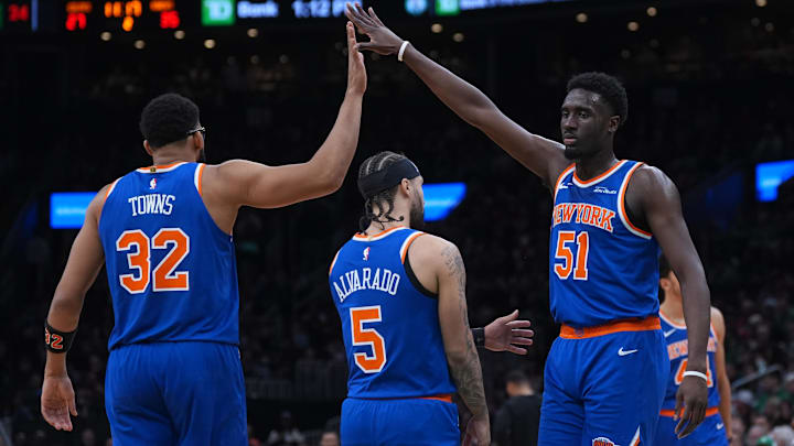 Feb 8, 2026; Boston, Massachusetts, USA; New York Knicks forward Mohamed Diawara (51) and center Karl-Anthony Towns (32) react after a play against the Boston Celtics in the second quarter at TD Garden.