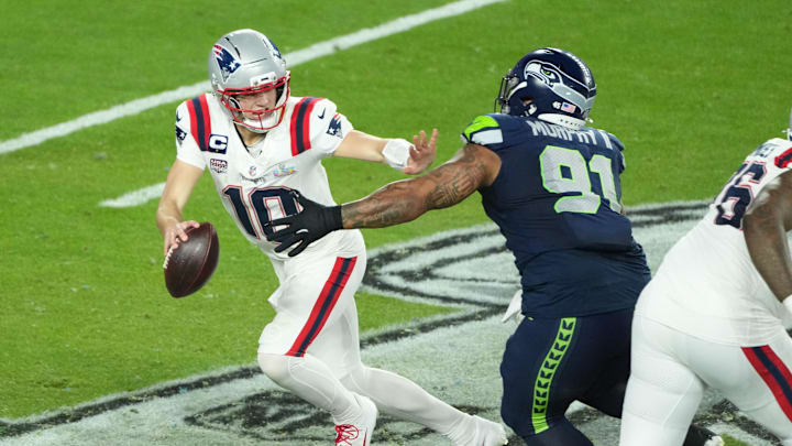 Feb 8, 2026; Santa Clara, CA, USA; New England Patriots quarterback Drake Maye (10) is pressured by Seattle Seahawks defensive tackle Byron Murphy II (91) in the second half in Super Bowl LX at Levi's Stadium. Mandatory Credit: Kirby Lee-Imagn Images