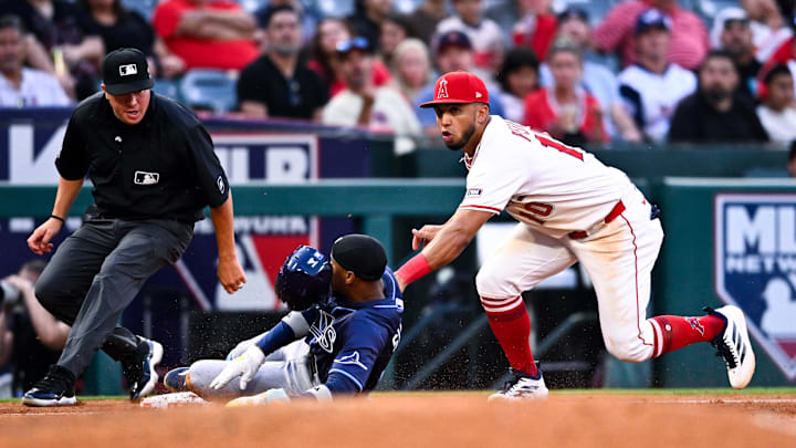 Aug 5, 2025; Anaheim, California, USA; Los Angeles Angels third baseman Oswald Peraza (10) tags out Tampa Bay Rays left fielder Chandler Simpson (14) at third base during the fourth inning at Angel Stadium of Anaheim. Mandatory Credit: Kelvin Kuo-Imagn Images Aug 5, 2025; Anaheim, California, USA; Los Angeles Angels third baseman Oswald Peraza (10) tags out Tampa Bay Rays left fielder Chandler Simpson (14) at third base during the fourth inning at Angel Stadium of Anaheim. Mandatory Credit: Kelvin Kuo-Imagn Images