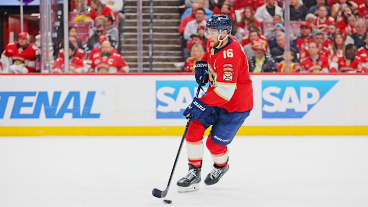 May 26, 2025; Sunrise, Florida, USA; Florida Panthers center Aleksander Barkov (16) controls the puck during the first period against the Carolina Hurricanes in game four of the Eastern Conference Final of the 2025 Stanley Cup Playoffs at Amerant Bank Arena. 